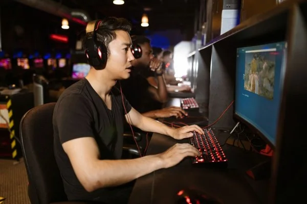 gamer playing computer keyboard